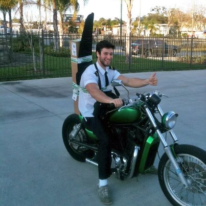 riding motorcycle with rifle