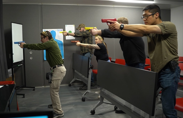 holster skills level 1 in classroom with instructor and training guns